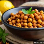대체 단백질을 활용한 다양한 건강 스낵 - A vibrant and colorful close-up of a rustic wooden bowl filled with crunchy roasted chickpeas season...